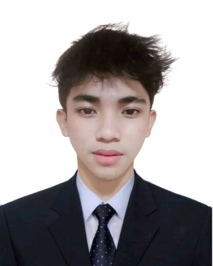 Joseph Berin wearing a suit and tie